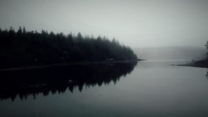 A photograph of an island in the mist.